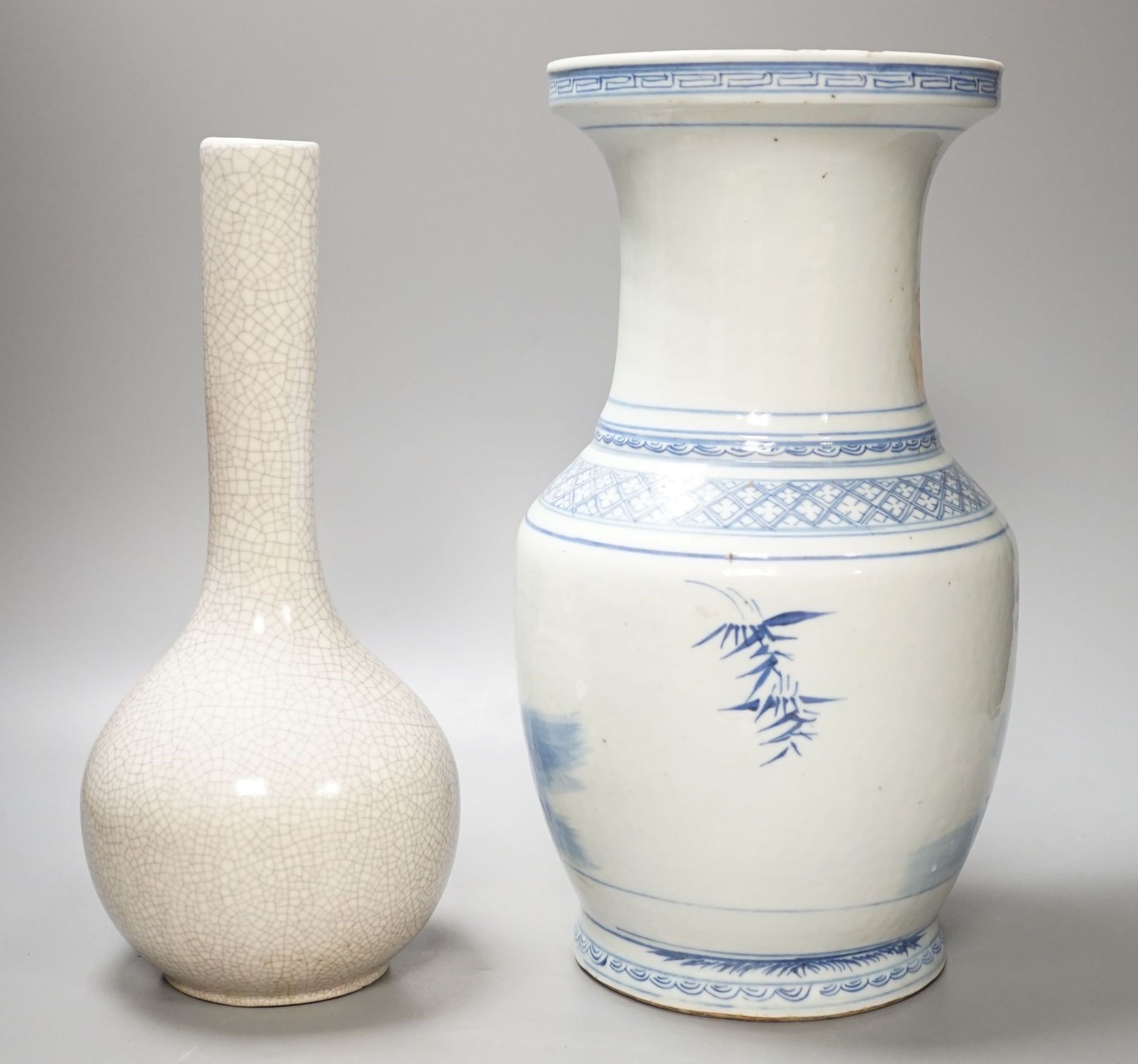 A Chinese blue and white vase and a crackle glaze bottle vase, tallest 34.5 cms high.